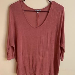 Pink loose shirt with black zipper on back